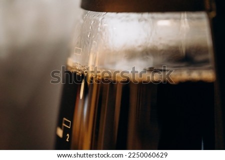Close-up of electric glass coffee pot with measurer
 Royalty-Free Stock Photo #2250060629