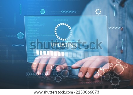 businessman hand working with laptop and virtual update screen , software system update process