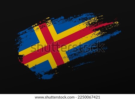 Abstract creative patriotic hand painted stain brush flag of Aland Islands on black background