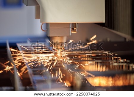 CNC Laser cutting of metal, modern industrial technology Making Industrial Details. The laser optics and CNC (computer numerical control) are used to direct the material or the laser beam generated. Royalty-Free Stock Photo #2250074025