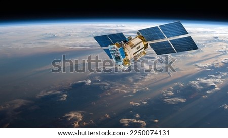 Space satellite orbiting the earth. Elements of this image furnished by NASA. Royalty-Free Stock Photo #2250074131