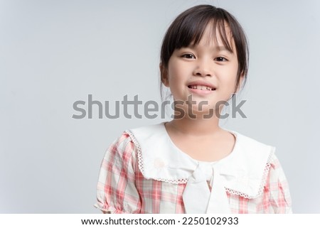 Image of Asian child posing on white background