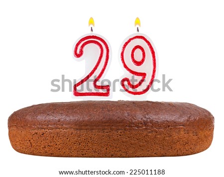birthday cake with candles number 29 isolated on white background