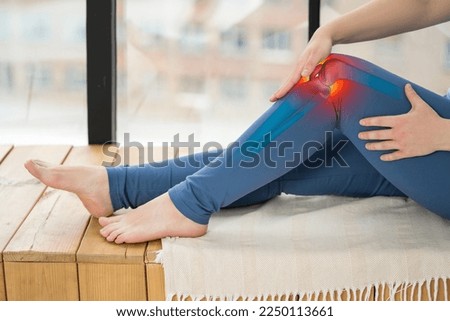 Knee pain, woman suffering from osteoarthritis at home, chiropractic treatments concept Royalty-Free Stock Photo #2250113661