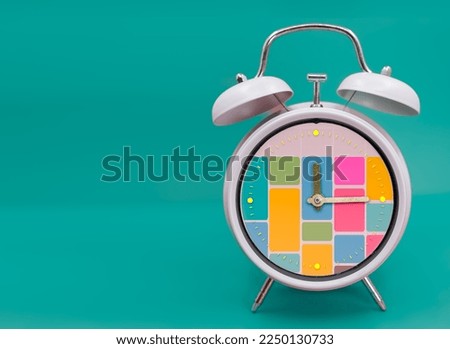 Ringing twin bell vintage classic alarm clock Isolated on blueand with the time blocking concept Royalty-Free Stock Photo #2250130733