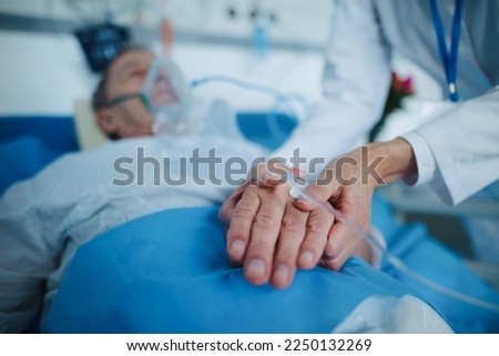 Close-up of nurse applying cannula at patients hand. Royalty-Free Stock Photo #2250132269