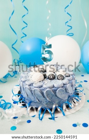 Happy fifth birthday vertical card with navy cake and number five candle with blue and white decoration