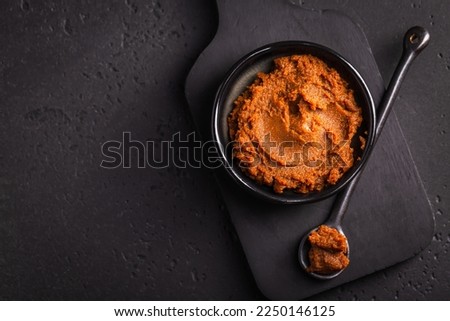 Miso paste - Japanese traditional soybean processed foods, on black background Royalty-Free Stock Photo #2250146125