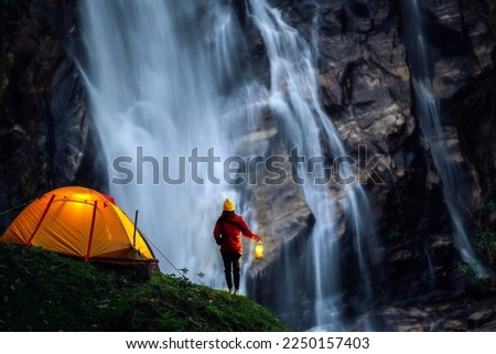 Light and campfire on night time at Mae tear waterfall near Doi inthanon in Chiang mai, Northen, Thailand Royalty-Free Stock Photo #2250157403