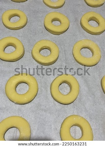 Donut dough circles before cooking