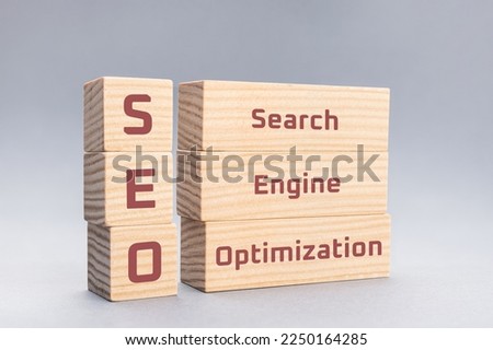 SEO Search Engine Optimization text on wooden blocks on gray background