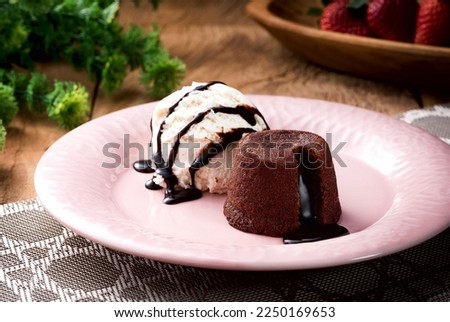 Delicious fresh fondant with hot chocolate and ice cream served on plate