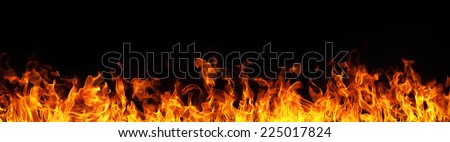 Fire flames on black background Royalty-Free Stock Photo #225017824