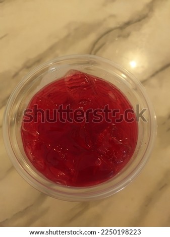 picture of a red drink made from roses that is called syrup.  very refreshing when drunk cold
