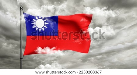 Taiwan national flag cloth fabric waving on beautiful grey sky.
