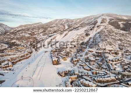 Aerial view of ski resort and mountain town of Steamboat Springs, Colorado with winter landscape and Mt. Werner Royalty-Free Stock Photo #2250212867
