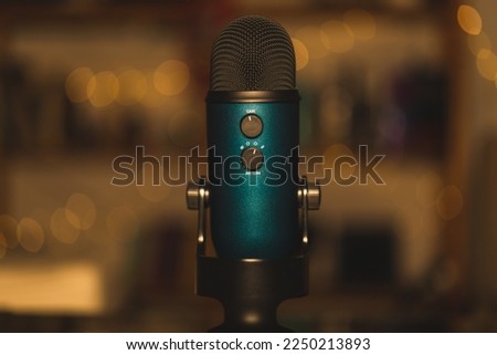 podcast microphone with gain and pattern options with blured background 