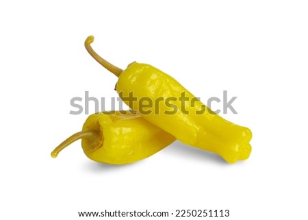 Two pickled yellow peppers, pepperoncini or friggitelli isolated on white background. Hot pepper marinated, brined. Traditional Italian and greek cuisine, ingredient for salad, pasta, sauce. Royalty-Free Stock Photo #2250251113