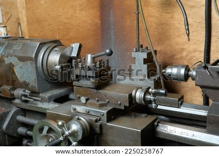 A general-purpose lathe in a metalworking factory Royalty-Free Stock Photo #2250258767