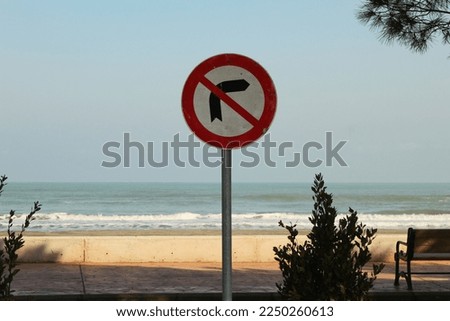 No turning right sign near beach. High quality photo