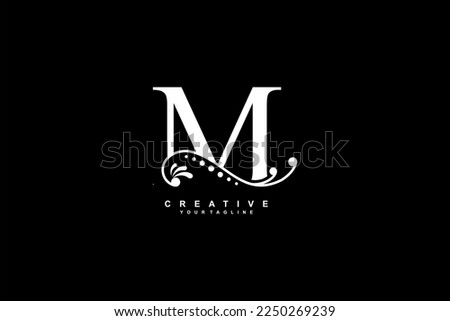 luxury beautiful white M logo design with flourish ornament and black background. monogram M. initial letter M. suitable for logos for business, company, product, housing, hotel etc