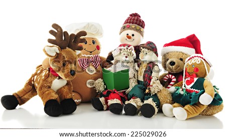 A collection of stuffed Christmas critters surrounding Ma Bunny who holds a Christmas carol book (or storybook) for the others to enjoy.  On a white background.