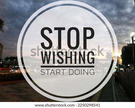 Inspirational motivational quotes, Stop Wishing Start Doing in pedestrian background.