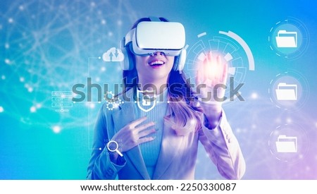 Business, technology, internet and networking concept. Asian businesswoman exploring virtual reality select the icon security on the virtual reality display. Metaverse concept. Royalty-Free Stock Photo #2250330087
