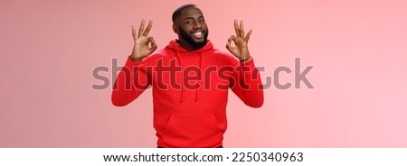 Guy promise perfection. Portrait confident charismatic pleasant african american man show okay no problem gesture say okay smiling assuring everything cool, standing pink background delighted. Royalty-Free Stock Photo #2250340963