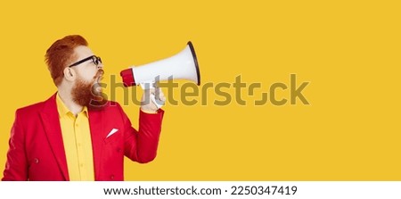 Profile view of funny chubby guy shouting through megaphone and making loud announcement isolated on solid yellow color blank text copy space banner background. Sale, discount, marketing concept Royalty-Free Stock Photo #2250347419