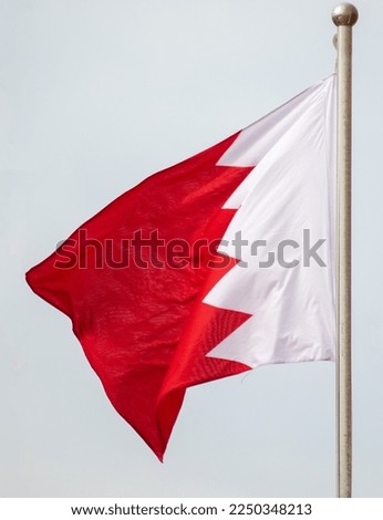 Flag of Qatar on the background of the sky. Symbol