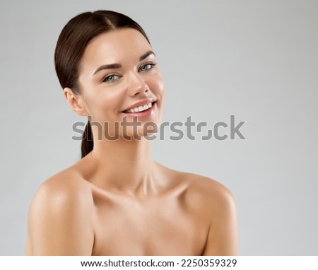 Happy Beauty Girl with Smooth Skin. Beautiful Model with Perfect Natural Make up over White. Cheerful smiling Young Woman. Women Face and Body Skin Care Spa Cosmetology Royalty-Free Stock Photo #2250359329