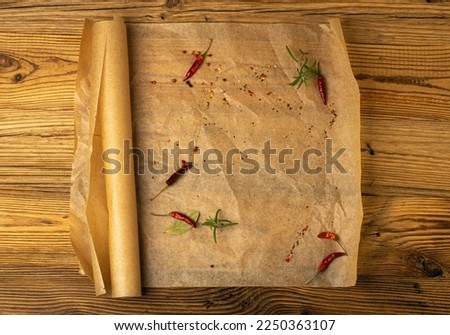 Brown Baking Paper with Herbs and Spices, Kraft Cooking Paper Sheet on Wooden Texture Background, Bakery Parchment Mockup, Greaseproof Baking Paper Top View