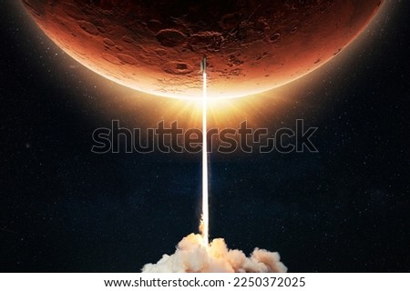 New space shuttle rocket with a blast takes off into space against the background of the red planet Mars and explores space at sunset. Concept of technology and travel to planet. Spaceship lift off 
