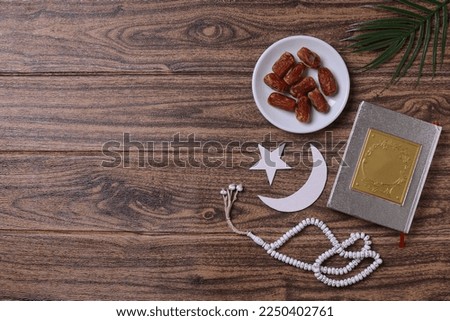 Muslim decoration on wooden background with copy space, ramadan kareem concept. 