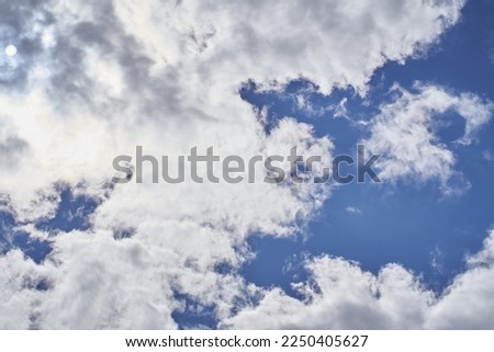 Beautiful blue sky and clouds are a natural background. With space to copy. Abstract template for flyers, postcards, posters, covers or interior design. High quality photo