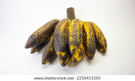 fresh ripe banana, with brown tone, selected focus, isolated on white background