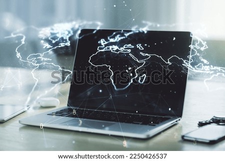 Multi exposure of abstract creative digital world map on laptop background, research and analytics concept Royalty-Free Stock Photo #2250426537