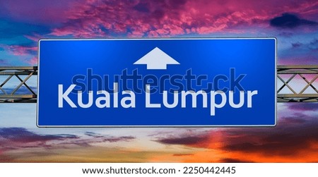 Road sign indicating direction to the city of Kuala Lumpur.