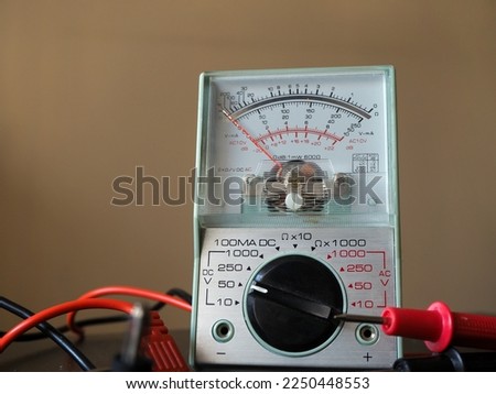 Analog multimeter. Ohmmeter, voltmeter and ammeter in one. Royalty-Free Stock Photo #2250448553