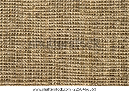 background from natural brown cloth. burlap texture top view Royalty-Free Stock Photo #2250466563