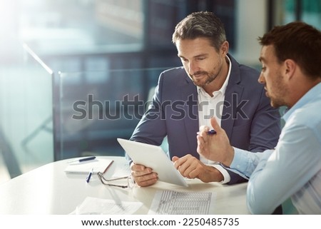 Tablet, teamwork and business people talking in office workplace. Collaboration, technology and workers, men or employees with touchscreen planning sales, marketing or advertising strategy in company Royalty-Free Stock Photo #2250485735