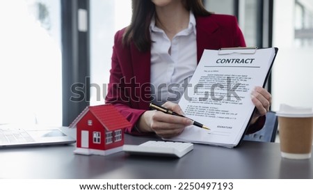 Business woman doing real estate sale, installment payment and mortgage loan concept. 