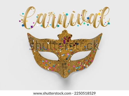 Shiny carnival mask on light background