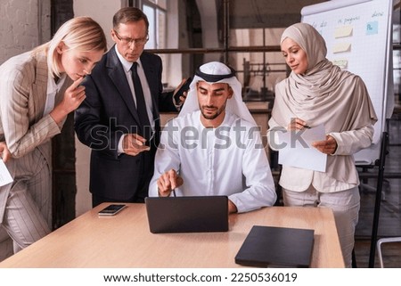 Multiethnic corporate business team meeting in the office for a strategic marketing plan - Office workers, entrepreneurs and company employee at work in a multinational company Royalty-Free Stock Photo #2250536019