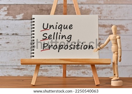 There is notebook with the word Unique Selling Proposition. It is an eye-catching image.