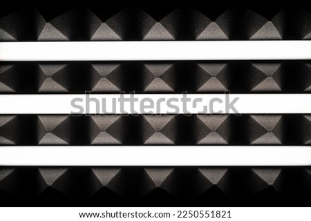 Monochrome black and white geometric background with acoustic foams in the form of pyramids