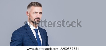 mature man with grizzled hair in formal suit copy space, formal. Man face portrait, banner with copy space. Royalty-Free Stock Photo #2250557351