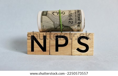 NPS or national pension scheme with wooden bids or blocks.  Royalty-Free Stock Photo #2250573557