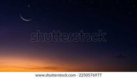 Crescent moon on dusk sky twilight background, religion of Islamic and well editing text Ramadan Kareem, Eid Mubarak, Eid Ul Fitr, Eid Al Adha, Muharram 